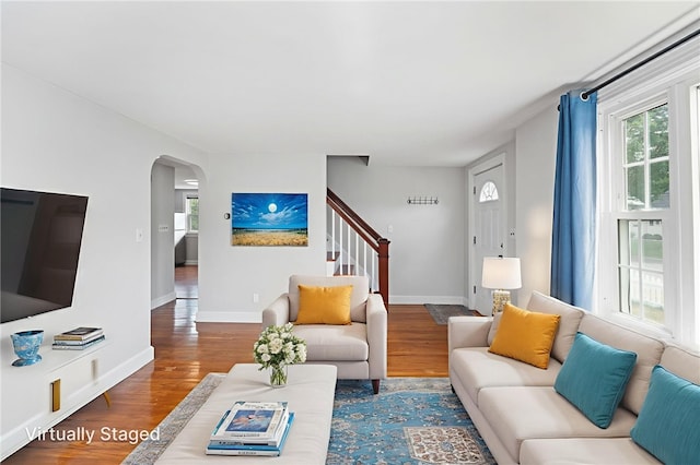 32 Rosemere Dr, East Providence, RI 02914 - living area with stairway, arched walkways, and wood finished floors