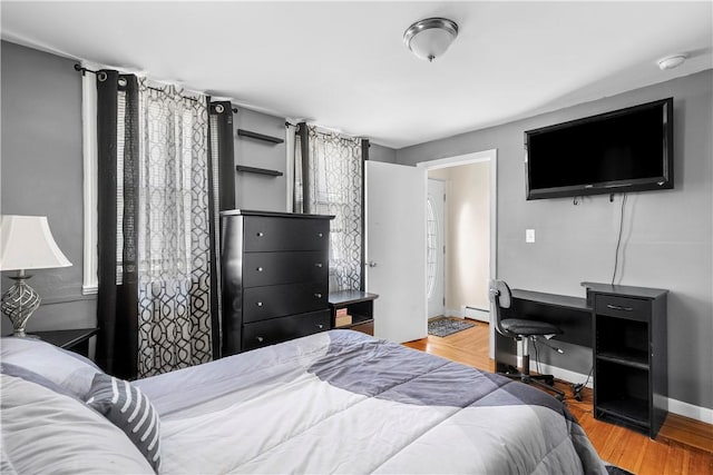 7 Snell Ct, West Warwick, RI 02893 - bedroom with wood finished floors and baseboard heating