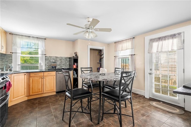 7 Snell Ct, West Warwick, RI 02893 - kitchen with stainless steel appliances, plenty of natural light, decorative backsplash, and light brown cabinetry