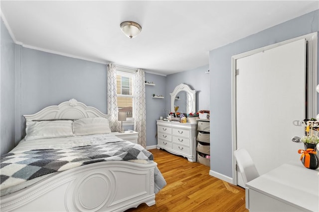 7 Snell Ct, West Warwick, RI 02893 - bedroom with light wood-type flooring and baseboards