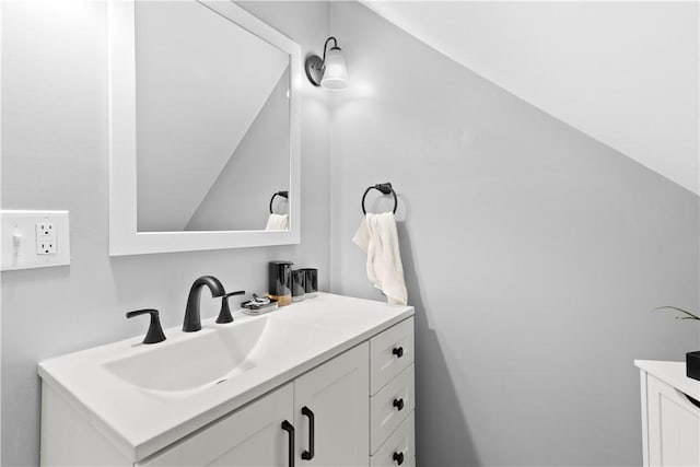 7 Snell Ct, West Warwick, RI 02893 - bathroom featuring vanity and vaulted ceiling