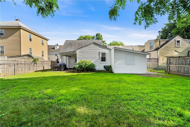7 Snell Ct, West Warwick, RI 02893 - back of house with a fenced backyard