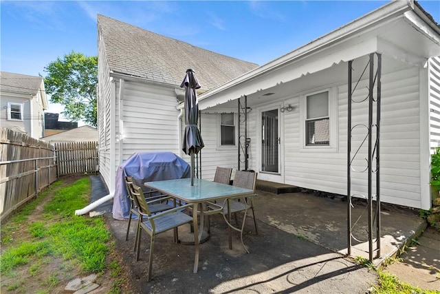 7 Snell Ct, West Warwick, RI 02893 - fenced backyard with a patio area, outdoor dining space, and area for grilling