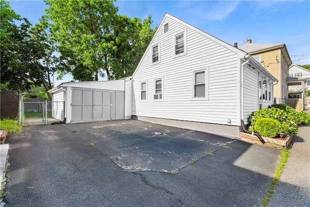 7 Snell Ct, West Warwick, RI 02893 - view of property exterior with a gate