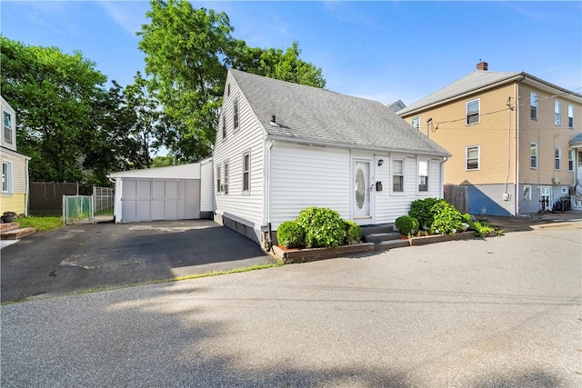 7 Snell Ct, West Warwick, RI 02893 - view of front facade with roof with shingles and a garage