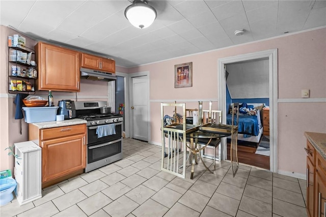 19 Covell St, Providence, RI 02909 - kitchen featuring double oven range, under cabinet range hood, open shelves, brown cabinetry, and light tile patterned floors