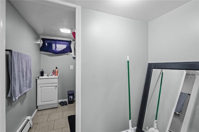 19 Covell St, Providence, RI 02909 - bathroom with baseboard heating and tile patterned floors