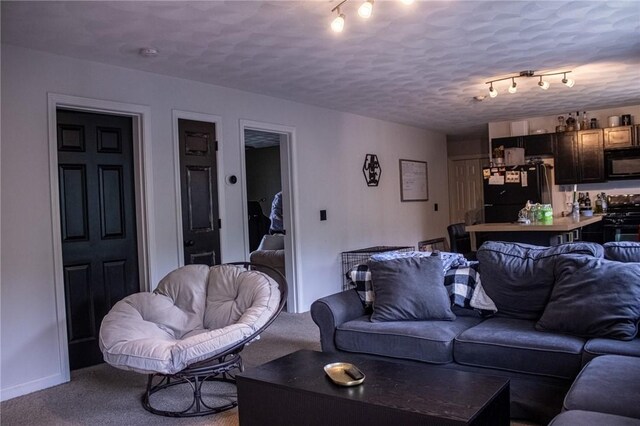 2 Main St Unit 21, Lincoln, RI 02802 - carpeted living room featuring track lighting