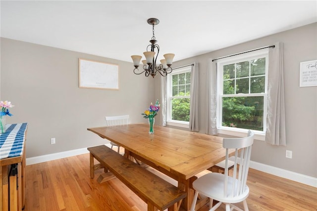 219 Fenner Hill Rd, Hopkinton, RI 02832 - dining space with a chandelier and light wood finished floors