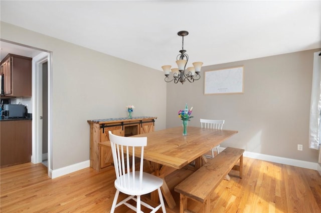 219 Fenner Hill Rd, Hopkinton, RI 02832 - dining area with light wood-style floors and a chandelier