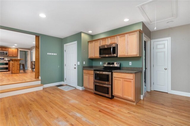 219 Fenner Hill Rd, Hopkinton, RI 02832 - kitchen with stainless steel appliances, light wood-style flooring, recessed lighting, dark countertops, and light brown cabinetry