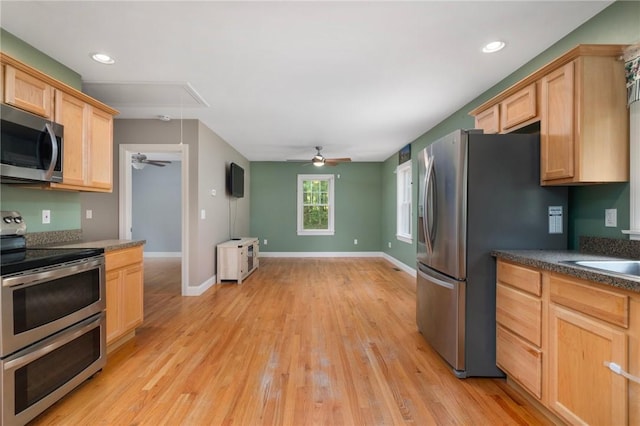 219 Fenner Hill Rd, Hopkinton, RI 02832 - kitchen featuring stainless steel appliances, ceiling fan, light brown cabinets, light wood-style floors, and dark countertops