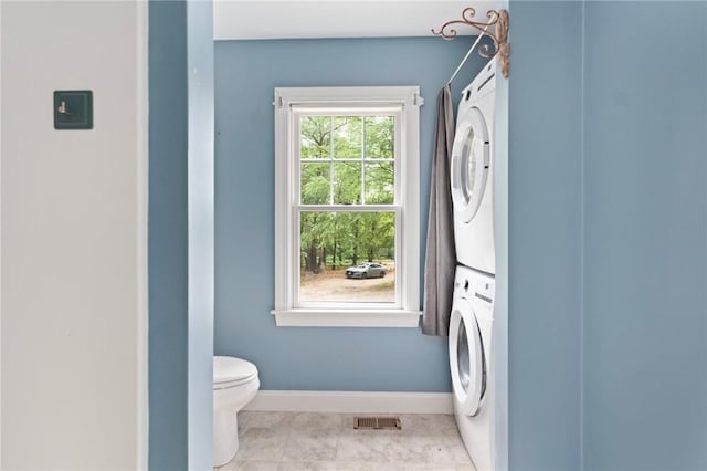 219 Fenner Hill Rd, Hopkinton, RI 02832 - laundry area with stacked washer / drying machine and baseboards