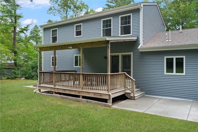 219 Fenner Hill Rd, Hopkinton, RI 02832 - rear view of house featuring a lawn, a wooden deck, a shingled roof, and a patio area