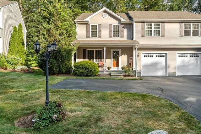 18 Country Hill Ln, Smithfield, RI 02917 - view of front of home featuring driveway, a porch, a front yard, and a garage