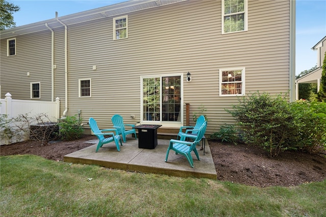 18 Country Hill Ln, Smithfield, RI 02917 - back of property with a patio area and a fire pit