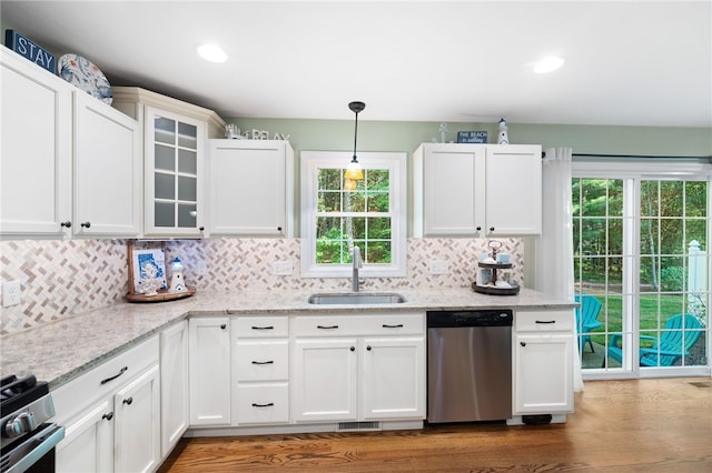 18 Country Hill Ln, Smithfield, RI 02917 - kitchen featuring appliances with stainless steel finishes, dark wood-style floors, decorative backsplash, glass insert cabinets, and recessed lighting