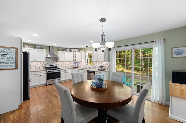 18 Country Hill Ln, Smithfield, RI 02917 - dining room featuring a chandelier and light wood finished floors