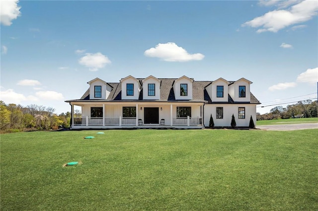 2 Winsor Rd, Scituate, RI 02857 - modern farmhouse with a front yard, a porch, and board and batten siding