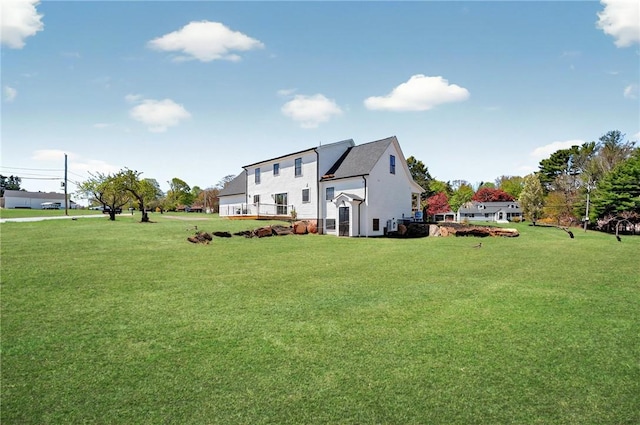 2 Winsor Rd, Scituate, RI 02857 - rear view of house with a yard