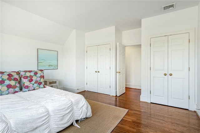 17 Ferolbink Way, Little Compton, RI 02837 - bedroom featuring two closets, wood finished floors, and lofted ceiling