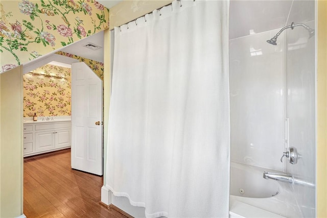 17 Ferolbink Way, Little Compton, RI 02837 - full bathroom with wallpapered walls, shower / tub combo, wood finished floors, and vanity