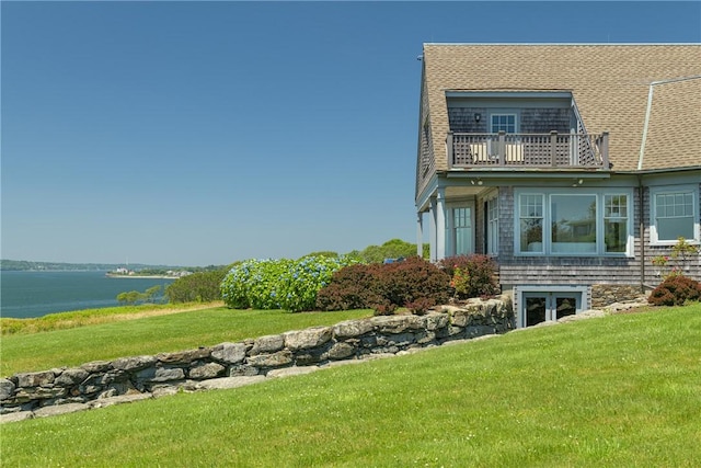 17 Ferolbink Way, Little Compton, RI 02837 - view of side of home with a balcony, a water view, and a lawn