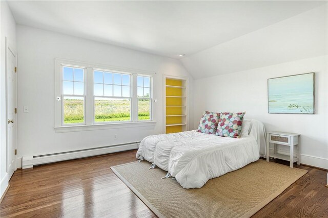 17 Ferolbink Way, Little Compton, RI 02837 - bedroom featuring a baseboard heating unit, vaulted ceiling, and wood finished floors