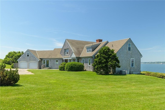 17 Ferolbink Way, Little Compton, RI 02837 - shingle-style home featuring a front lawn, a garage, a chimney, and driveway