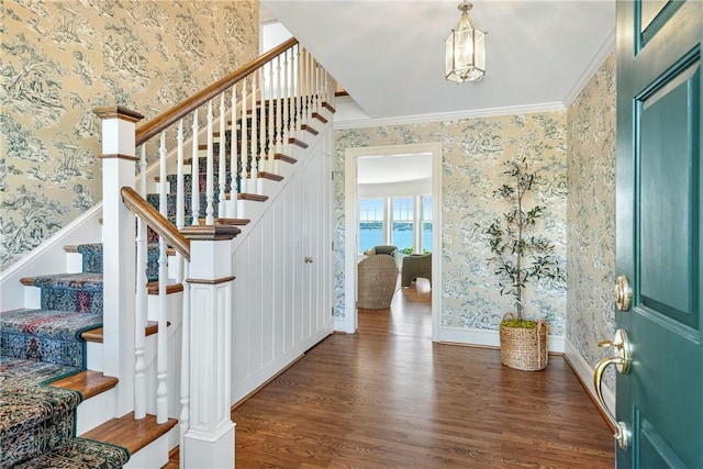 17 Ferolbink Way, Little Compton, RI 02837 - foyer with wallpapered walls, wood finished floors, stairs, ornamental molding, and a chandelier