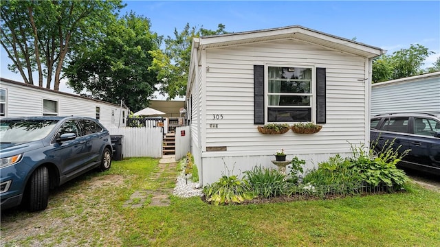 245 Manton St, Pawtucket, RI 02861 - view of property exterior featuring a lawn