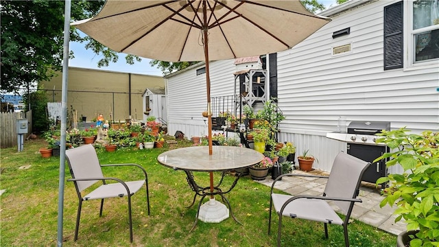 245 Manton St, Pawtucket, RI 02861 - view of patio featuring area for grilling and an outbuilding