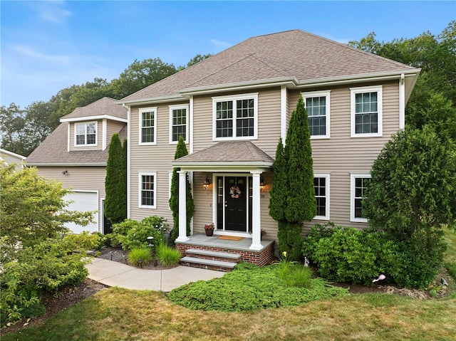 10 Sables Way, Lincoln, RI 02865 - view of front of house featuring a garage, a shingled roof, and a front yard