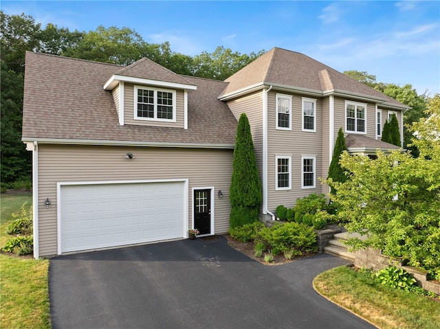10 Sables Way, Lincoln, RI 02865 - view of front of house featuring a garage, roof with shingles, and asphalt driveway