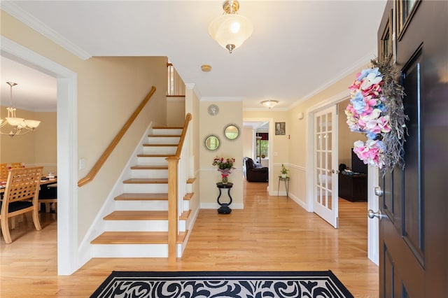 10 Sables Way, Lincoln, RI 02865 - entrance foyer featuring stairway, light wood-style floors, a chandelier, and ornamental molding