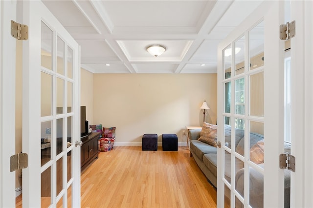 10 Sables Way, Lincoln, RI 02865 - sitting room featuring french doors, light wood-style floors, beamed ceiling, and coffered ceiling