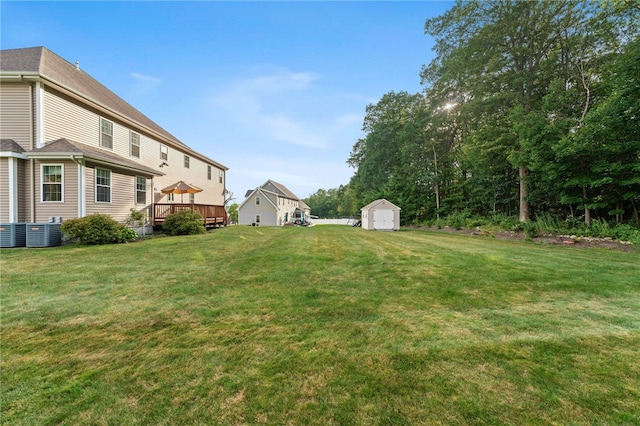 10 Sables Way, Lincoln, RI 02865 - view of grassy yard with a shed, a wooden deck, and a detached garage