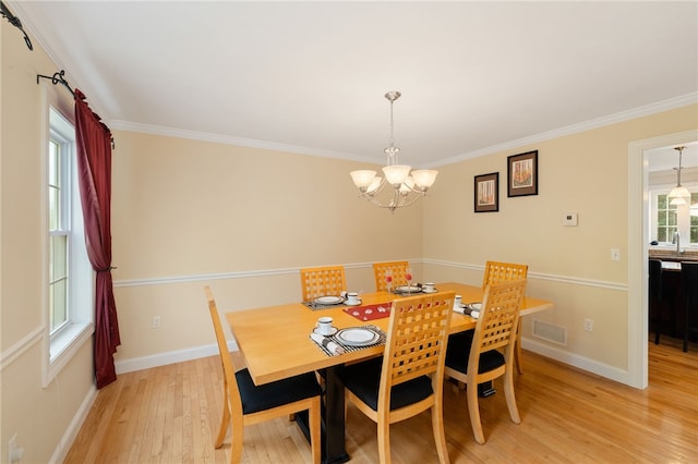 10 Sables Way, Lincoln, RI 02865 - dining area with a chandelier, light wood finished floors, and ornamental molding