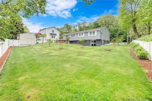 1463 Broadway Way E, Providence, RI 02914 - fenced backyard featuring an outbuilding