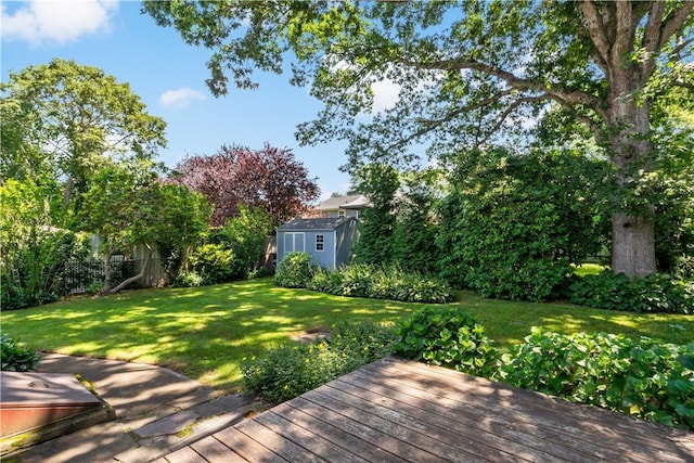 55 Wayland Trl, Narragansett, RI 02882 - view of yard featuring a storage unit and a wooden deck