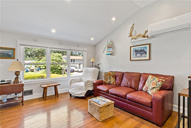 55 Wayland Trl, Narragansett, RI 02882 - living room featuring a wall mounted AC, vaulted ceiling, wood finished floors, and recessed lighting