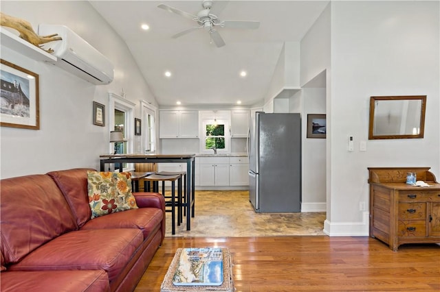 55 Wayland Trl, Narragansett, RI 02882 - living area with light wood-style flooring, a wall unit AC, ceiling fan, recessed lighting, and high vaulted ceiling