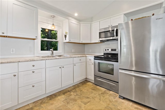 55 Wayland Trl, Narragansett, RI 02882 - kitchen featuring stainless steel appliances, white cabinetry, stone finish flooring, pendant lighting, and light stone counters