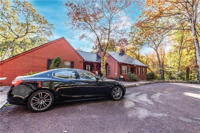 584 Division Rd, East Greenwich, RI 02818 - view of property exterior featuring a chimney