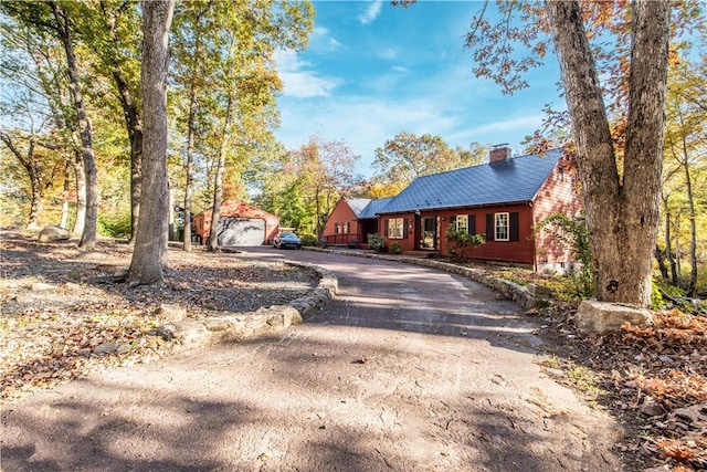 584 Division Rd, East Greenwich, RI 02818 - view of front of property featuring curved driveway, a chimney, and an outdoor structure