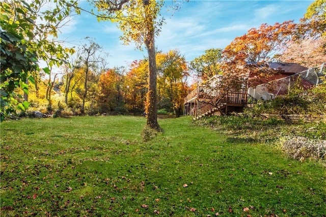 584 Division Rd, East Greenwich, RI 02818 - view of green lawn with stairs and a wooden deck