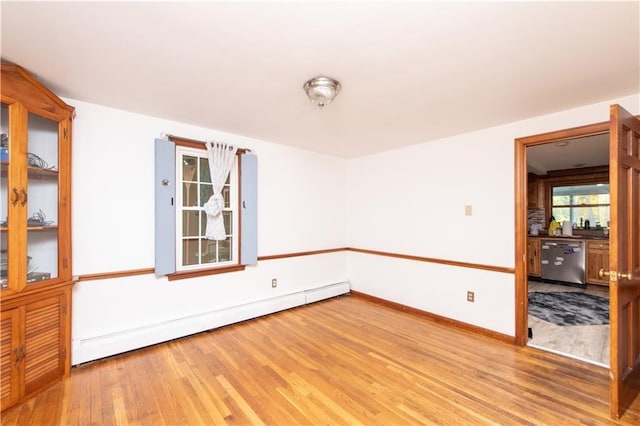 584 Division Rd, East Greenwich, RI 02818 - spare room with baseboard heating and wood finished floors