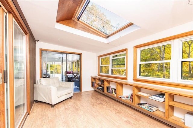 584 Division Rd, East Greenwich, RI 02818 - sitting room with a skylight, light wood-style floors, and vaulted ceiling