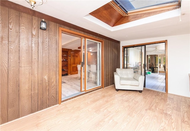 584 Division Rd, East Greenwich, RI 02818 - unfurnished room featuring wood finished floors, wooden walls, a raised ceiling, and a skylight