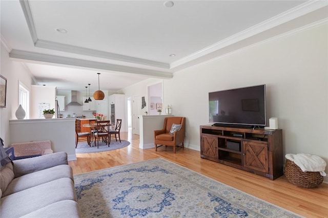 25 Kristin Dr, Cranston, RI 02921 - living room with light wood-style floors, a tray ceiling, and ornamental molding